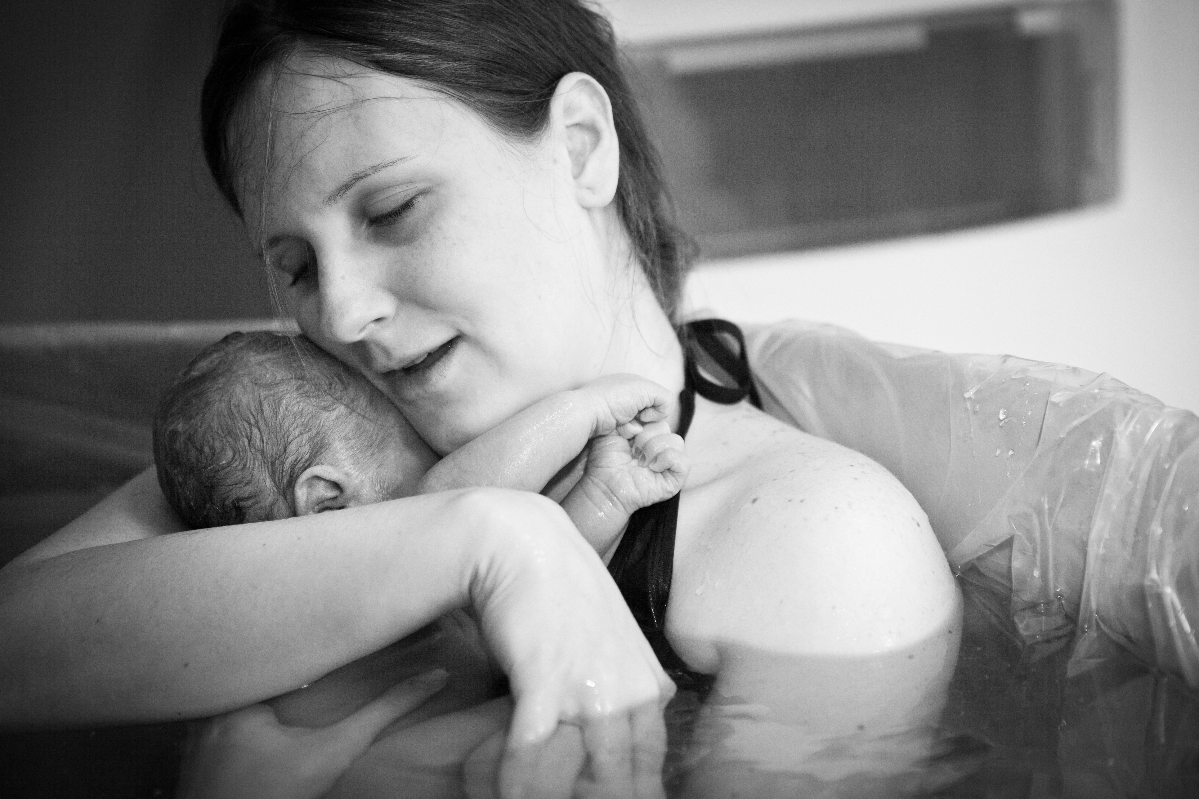 Mother-Embracing-Her-Newborn-after-Home-Water-Birth-510951457_3867x2578.jpeg